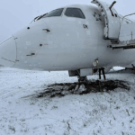 A photo of a LOT Polish Airlines aircraft arriving from Warsaw slid off the runway after landing at Vilnius Airport