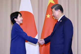 Japanese Prime Minister Sanae Takaichi shakes hands with Chinese President Xi Jinping ahead of their talks in Gyeongju, South Korea, October 31, 2025. Kyodo/via REUTERS/File Photo