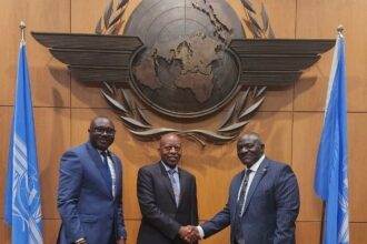 Uganda’s delegation poses at ICAO headquarters as Hon. Katumba Wamala congratulates Kabbs Tijuke on his designation to the Uganda ICAO Council 2025, reflecting progress in Uganda aviation and recent Uganda international air service agreements 2025.