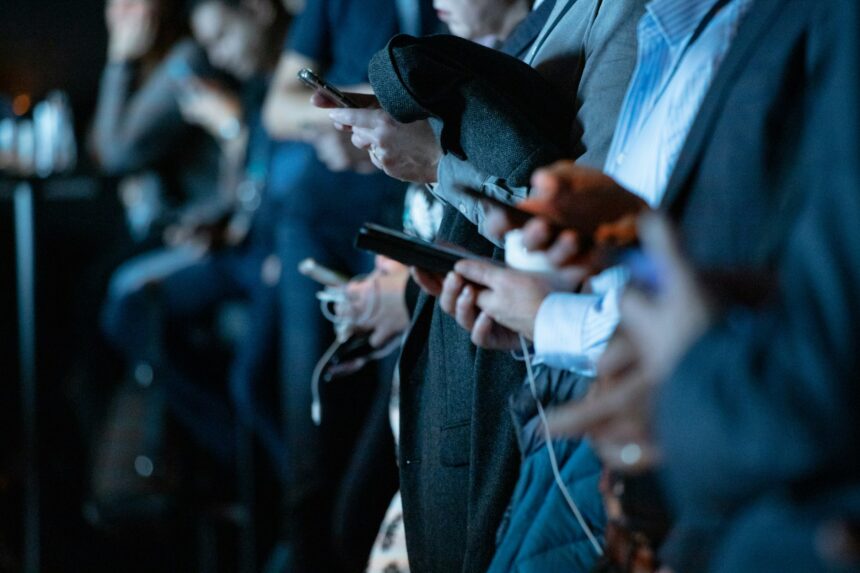 People using phone while standing