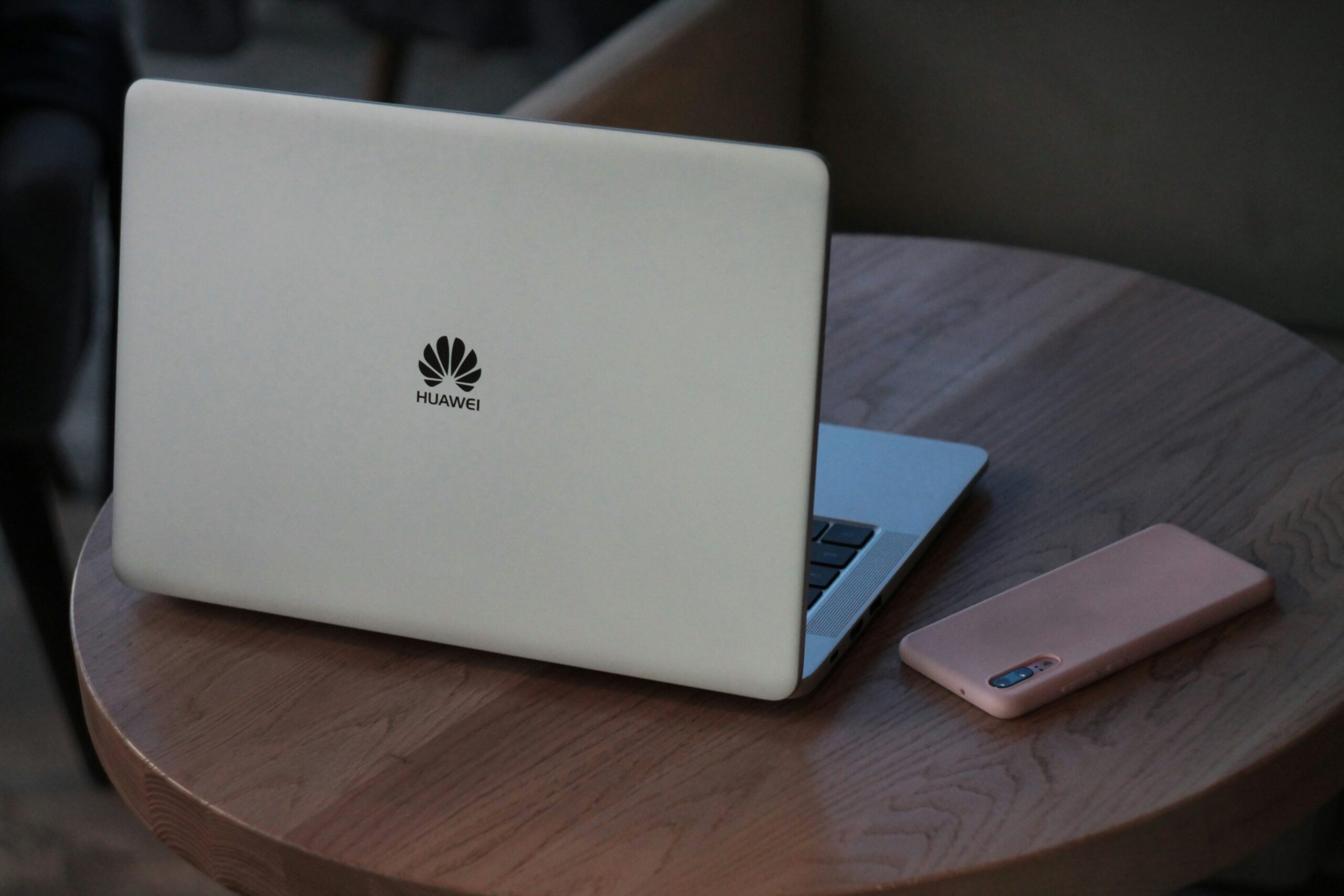 Huawei Laptop and phone on table 
