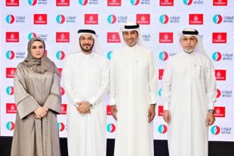 Executives of Emirates and ENOC stand together for a photograph
