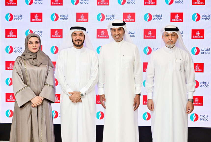 Executives of Emirates and ENOC stand together for a photograph