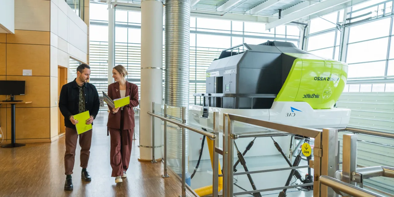 A picture of two people at airBaltic Training centre in Riga, Latvia
