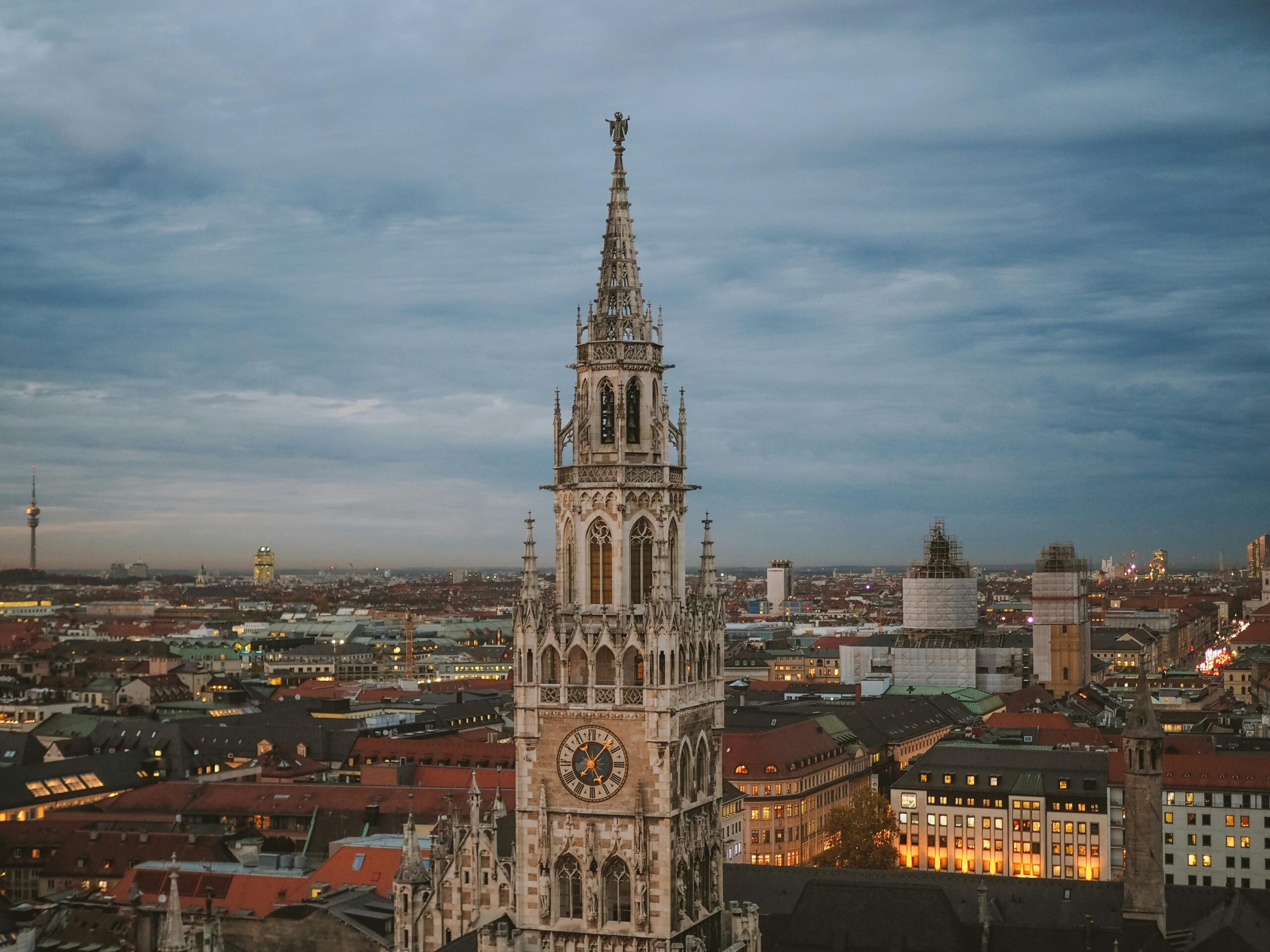 A view of the Marienplatz in Munich with other city buildings surrounding it.