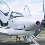 Photo of a White Aircraft with Open Doors