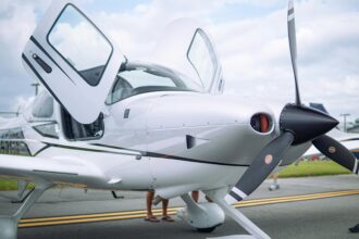 Photo of a White Aircraft with Open Doors