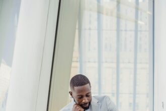 Man Sitting on a Bench and Checking the Time
