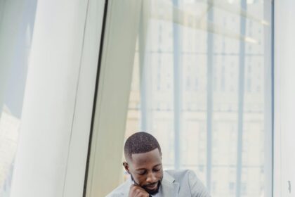 Man Sitting on a Bench and Checking the Time