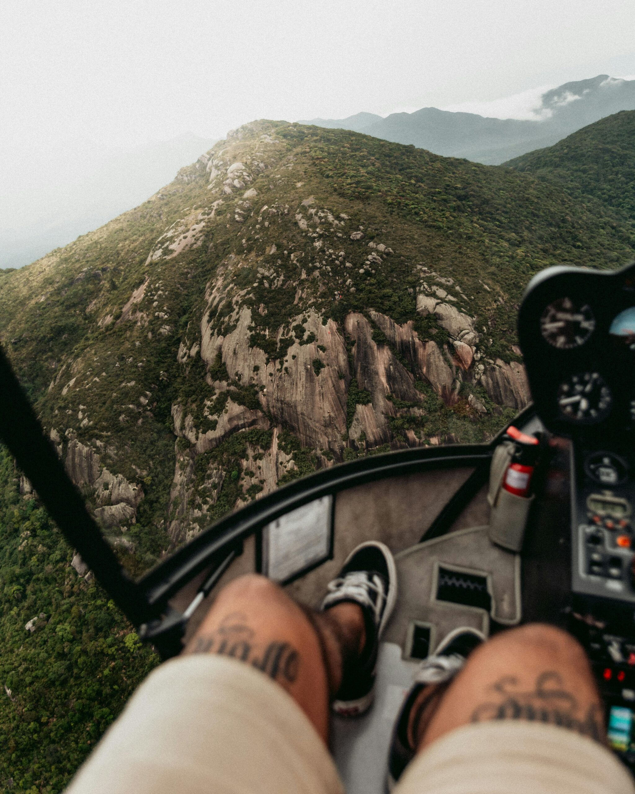 A man sitting in the front of a small aircraft