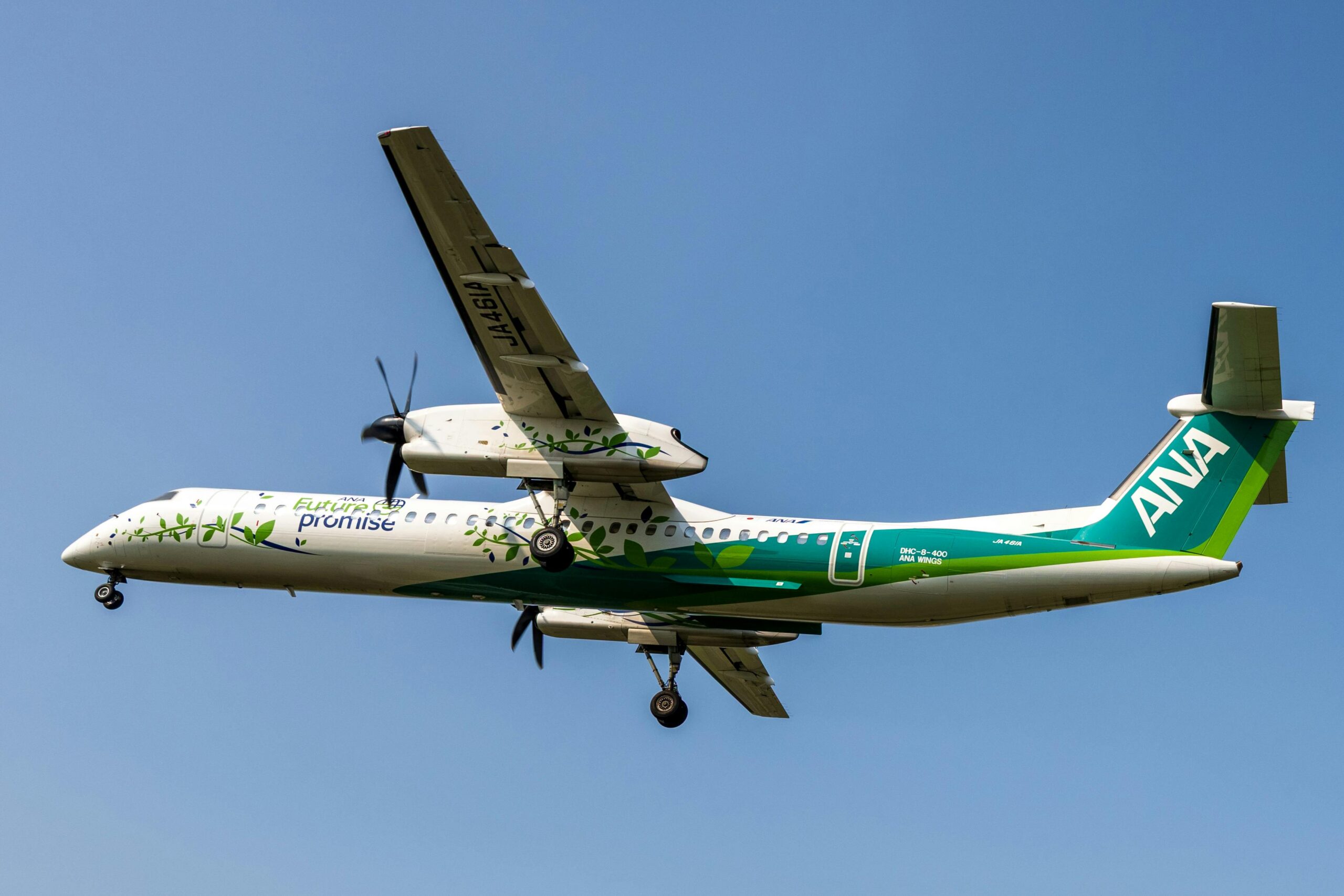 Airplane against clear blue sky