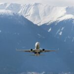 Airplane flying through mountains