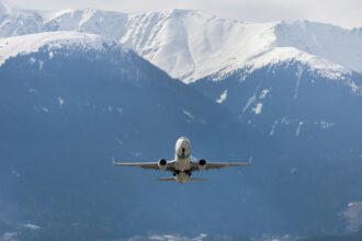 Airplane flying through mountains