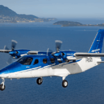 A Tecnam propellor plane in the air, one that Kenai Aviation had in its fleet.