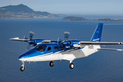 A Tecnam propellor plane in the air, one that Kenai Aviation had in its fleet.