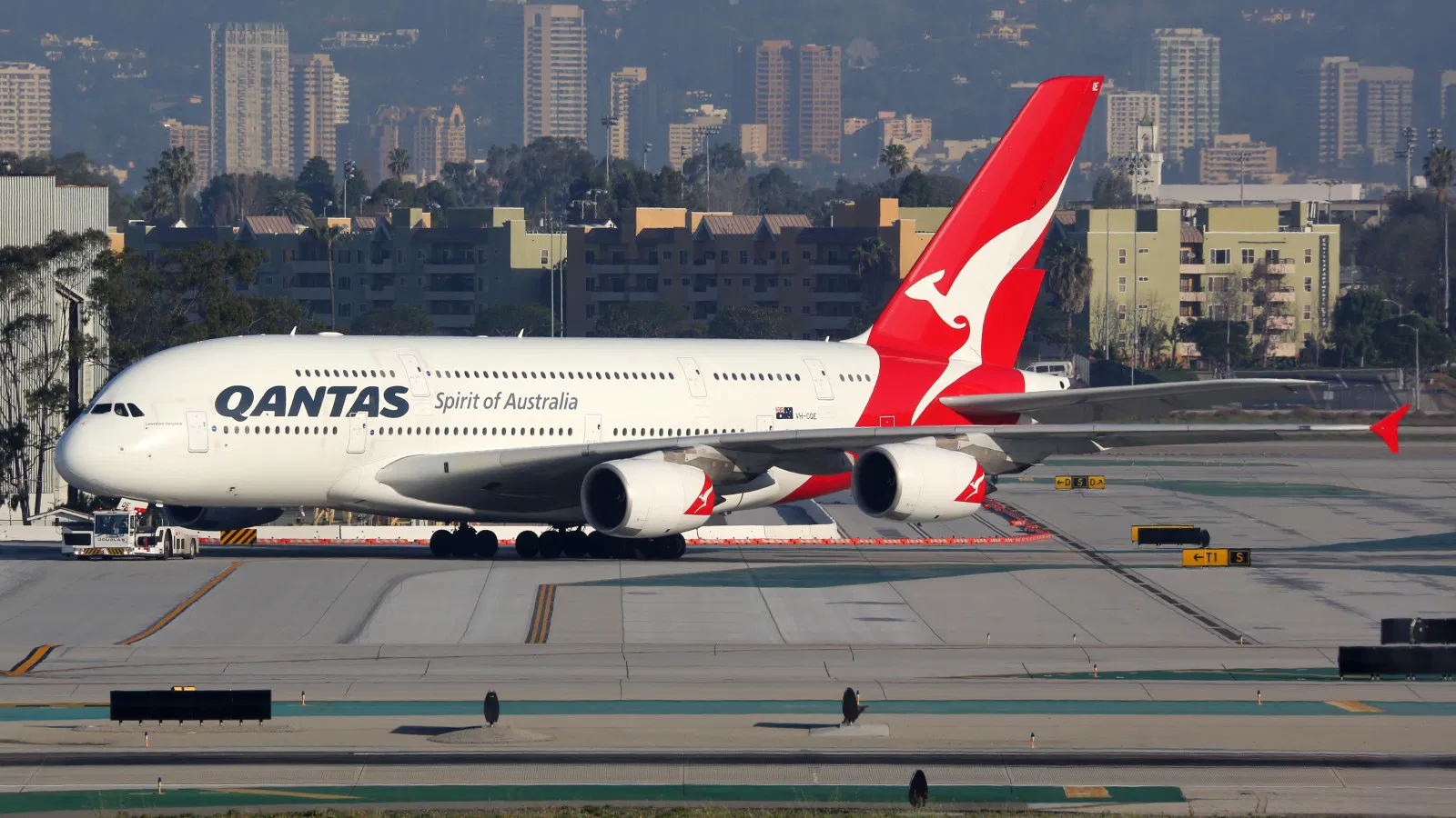 A Qantas A380 docked at the airport.