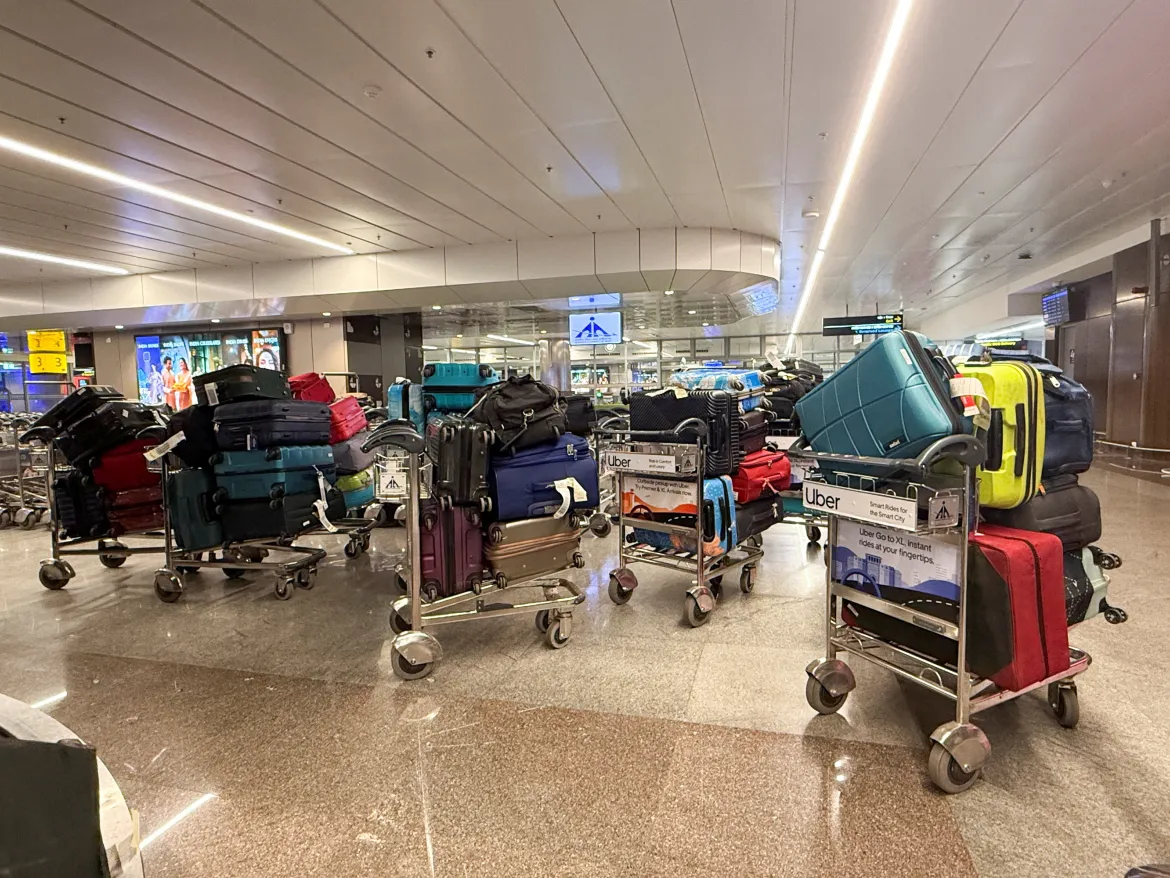 A photo of luggage sitting on trolleys at Pune airport