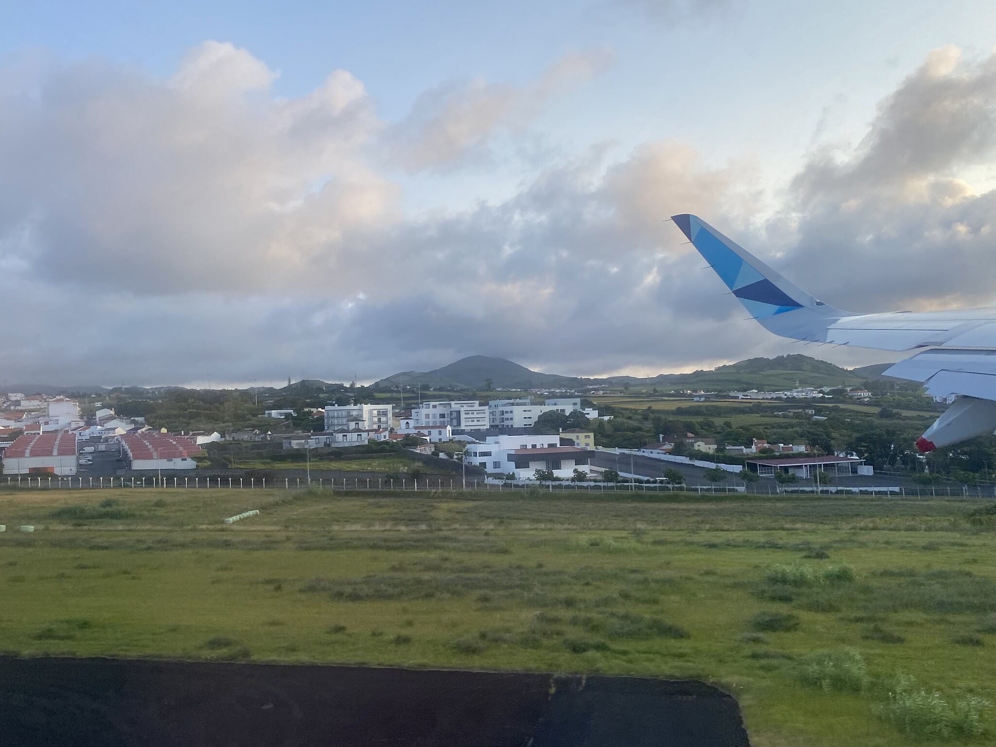 A view out of a plane window as the plane takes off from Sao Joao Paulo II Airport in the Azores.
