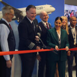 Captain Josh Hall, Managing Director of JFK Sylvia Rodriguez and the flight crew of Flight 3 cut the ceremonial ribbon to start boarding the inaugural flight of the Airbus A321XLR.