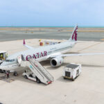 Qatar Airways 737-MAX aircraft stationed at an airport