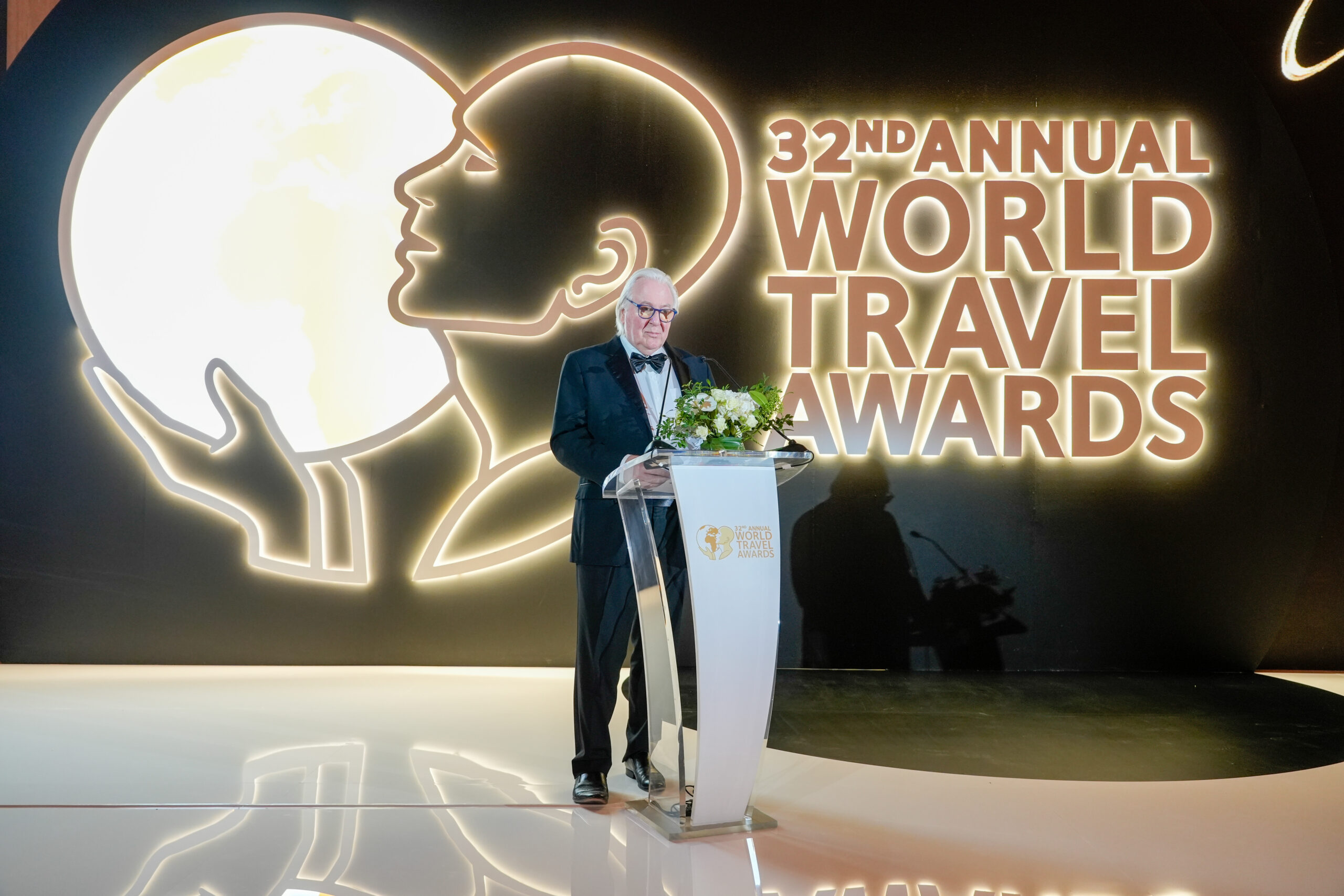 A person speaking in the awards stage