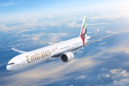 An aircraft flying over the clouds