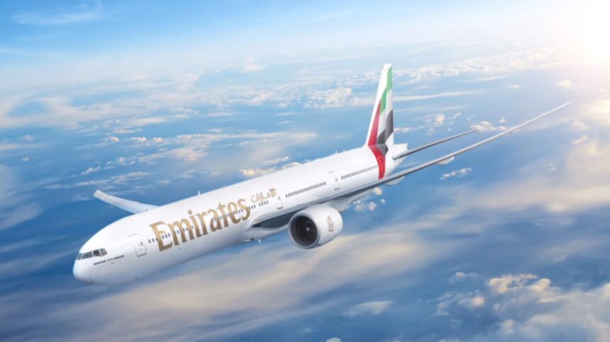 An aircraft flying over the clouds