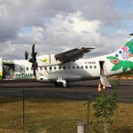 ATR-42-500, Air Antilles Express loading at an airport.