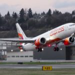 A Boeing 737-MAX 8 with Air India Express's logo taking off from Seattle.