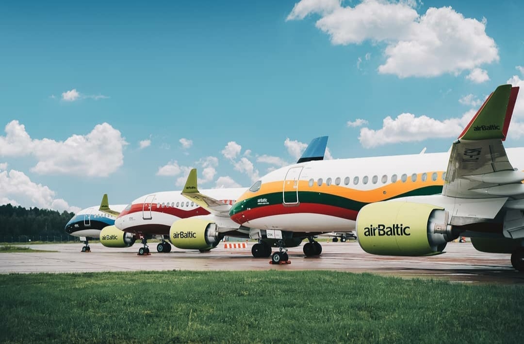 airBaltic aircrafts with the Estonian, Latvian and Lithuanian flags on them
