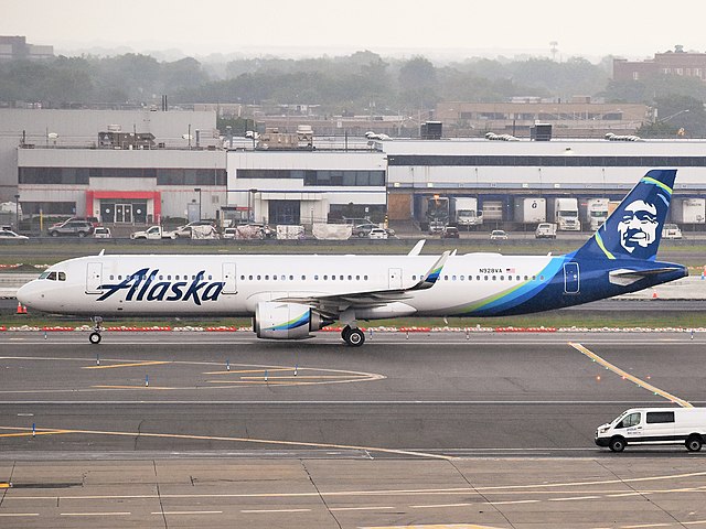An Alaska Airlines Airbus A321neo is taxiing to its gate at John F. Kennedy International Airport.
