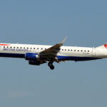 A British Airways plane with a Union Jack on the tail comes in for landing.