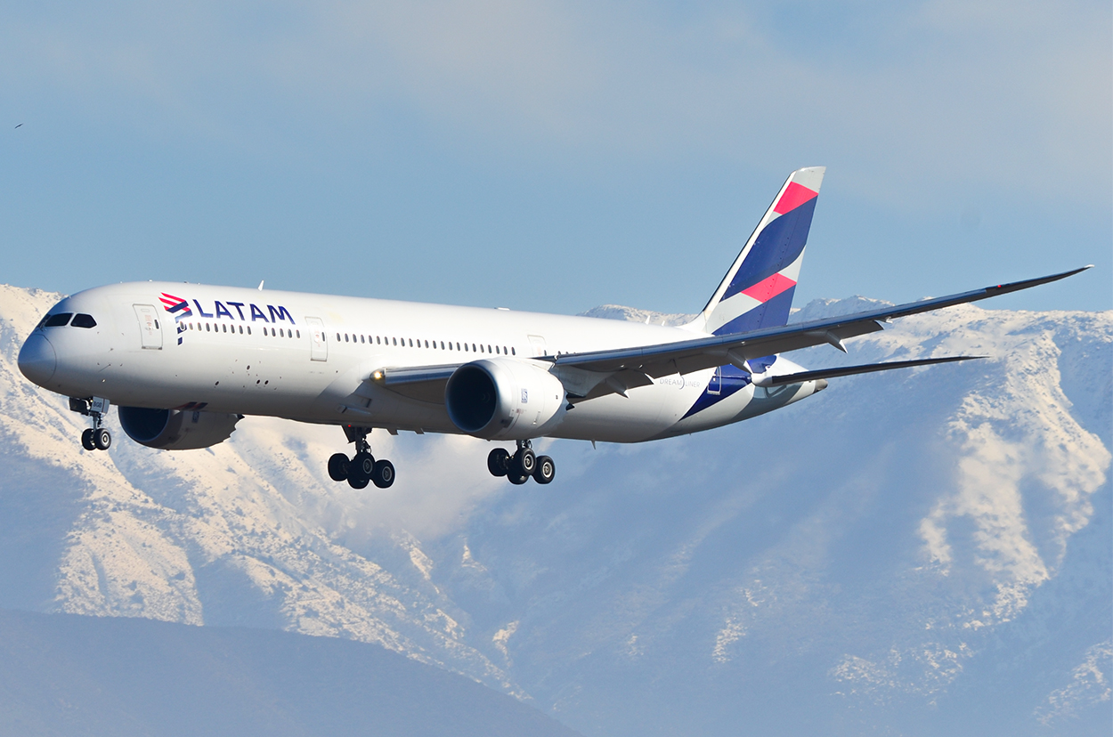 LATAM Chile Boeing 787-9 Dreamliner (CC-BGB) landing in Santiago de Chile with mountains in the background.