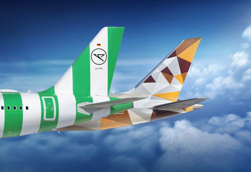 Tails of Condor and Etihad aircraft flying in the sky, showcasing both airlines’ branding.