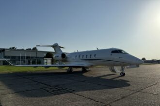 Air Charter Scotland Bombardier Challenger 350 (9H-MRT) parked on the tarmac at an airport, viewed from the side with the aircraft ready for departure.
