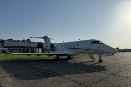 Air Charter Scotland Bombardier Challenger 350 (9H-MRT) parked on the tarmac at an airport, viewed from the side with the aircraft ready for departure.