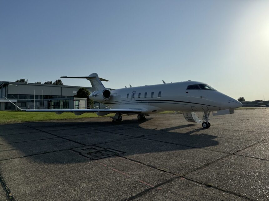 Air Charter Scotland Bombardier Challenger 350 (9H-MRT) parked on the tarmac at an airport, viewed from the side with the aircraft ready for departure.