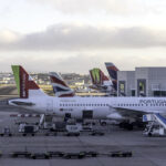 Several TAP Air Portugal aircrafts can be seen parked close to the plaftorms at the Lisbon Airport.
