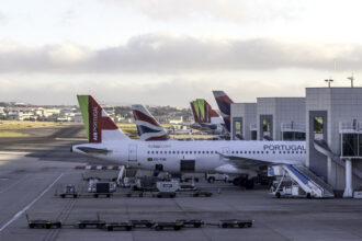 Several TAP Air Portugal aircrafts can be seen parked close to the plaftorms at the Lisbon Airport.