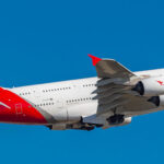 Airbus 380 from Qantas Airways flying in clear blue sky