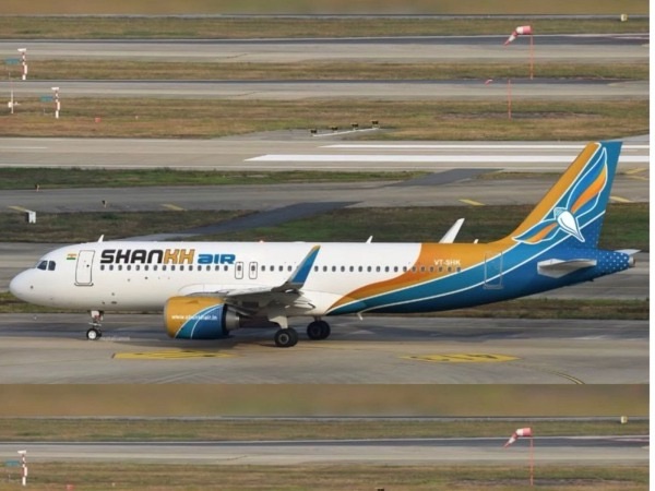 Shankh Air aircraft on the tarmac, with a tail painted yellow-to-blue