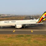 A Uganda Airlines B787 circling the runway.