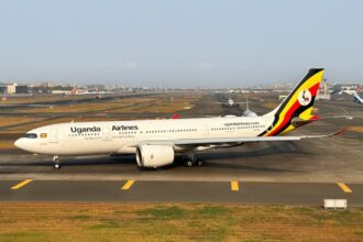 A Uganda Airlines B787 circling the runway.