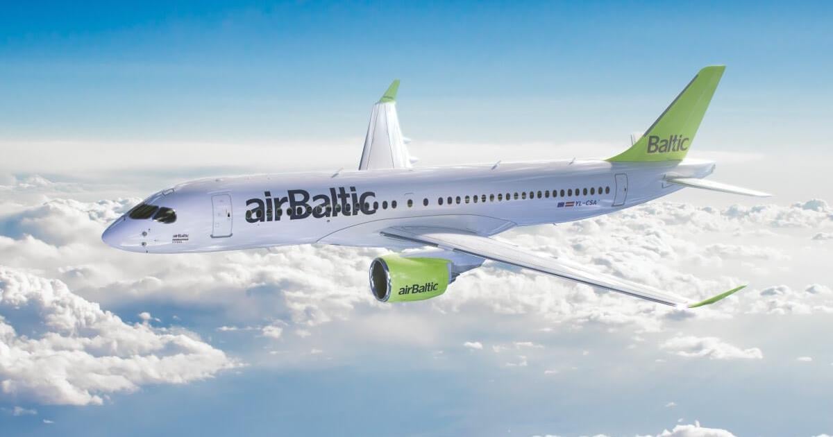 airBaltic Airbus A220-300 in flight above the clouds