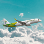 SalamAir Airbus A320 flying above the clouds.