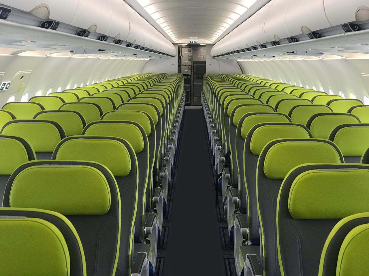 SalamAir Airbus A320 interior with green seats.