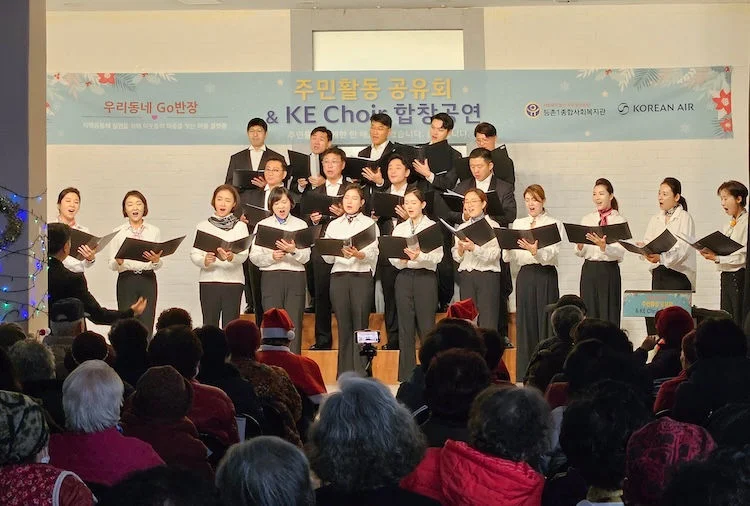 People singing at a charity concert for seniors