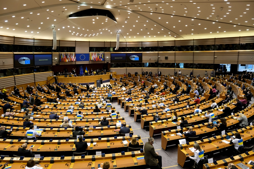 A round room with representatives attending a parliamentary conference.