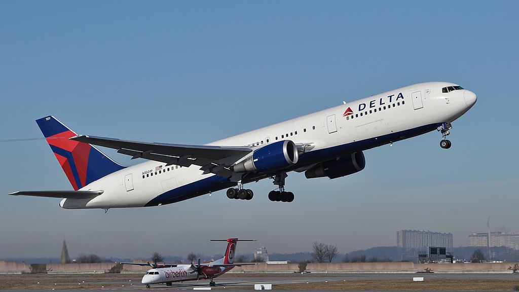 This image depicts an aircraft taking off from the airport