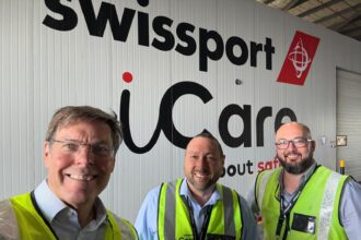 Warwick Brady with Swissport employees.